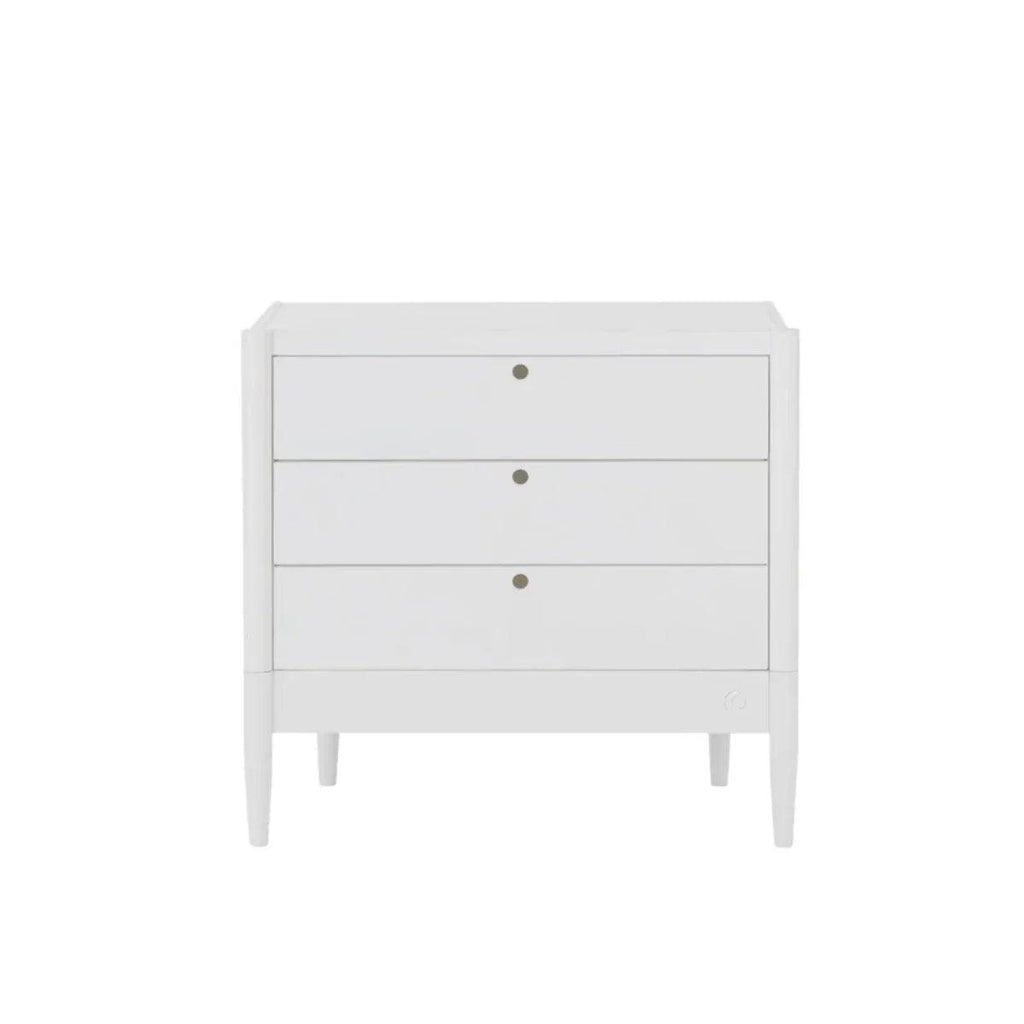 White baby dresser front view with three drawers and gold-tone center knobs