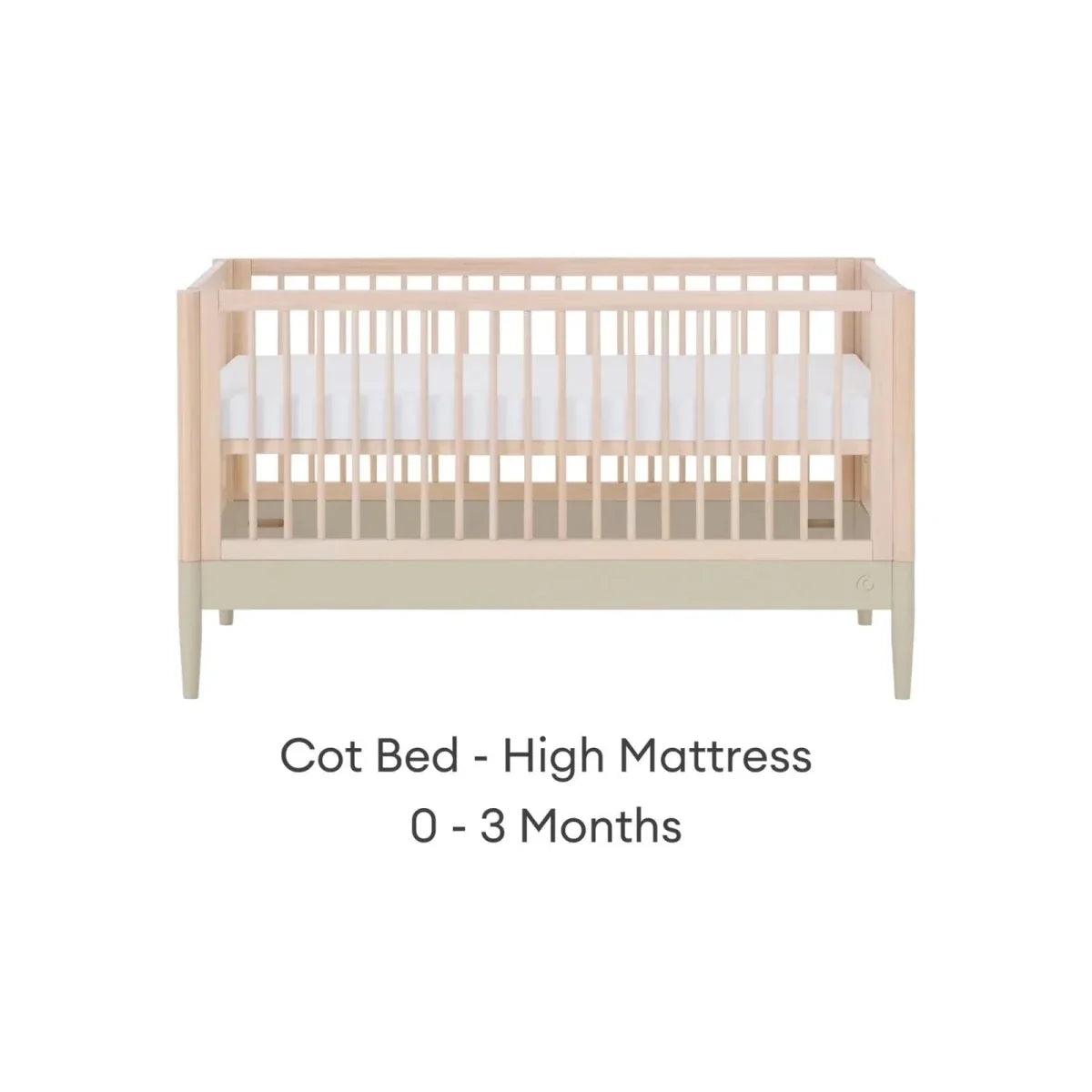 Light wood cot bed with vertical slats and sage rail, high mattress position