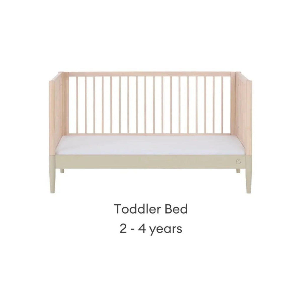 Light wood toddler bed with low rail and sage accent, slatted headboard