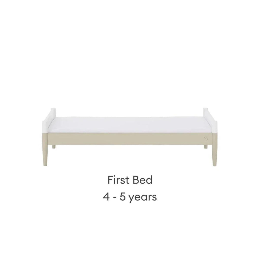 White first bed frame with low rail and light wood legs