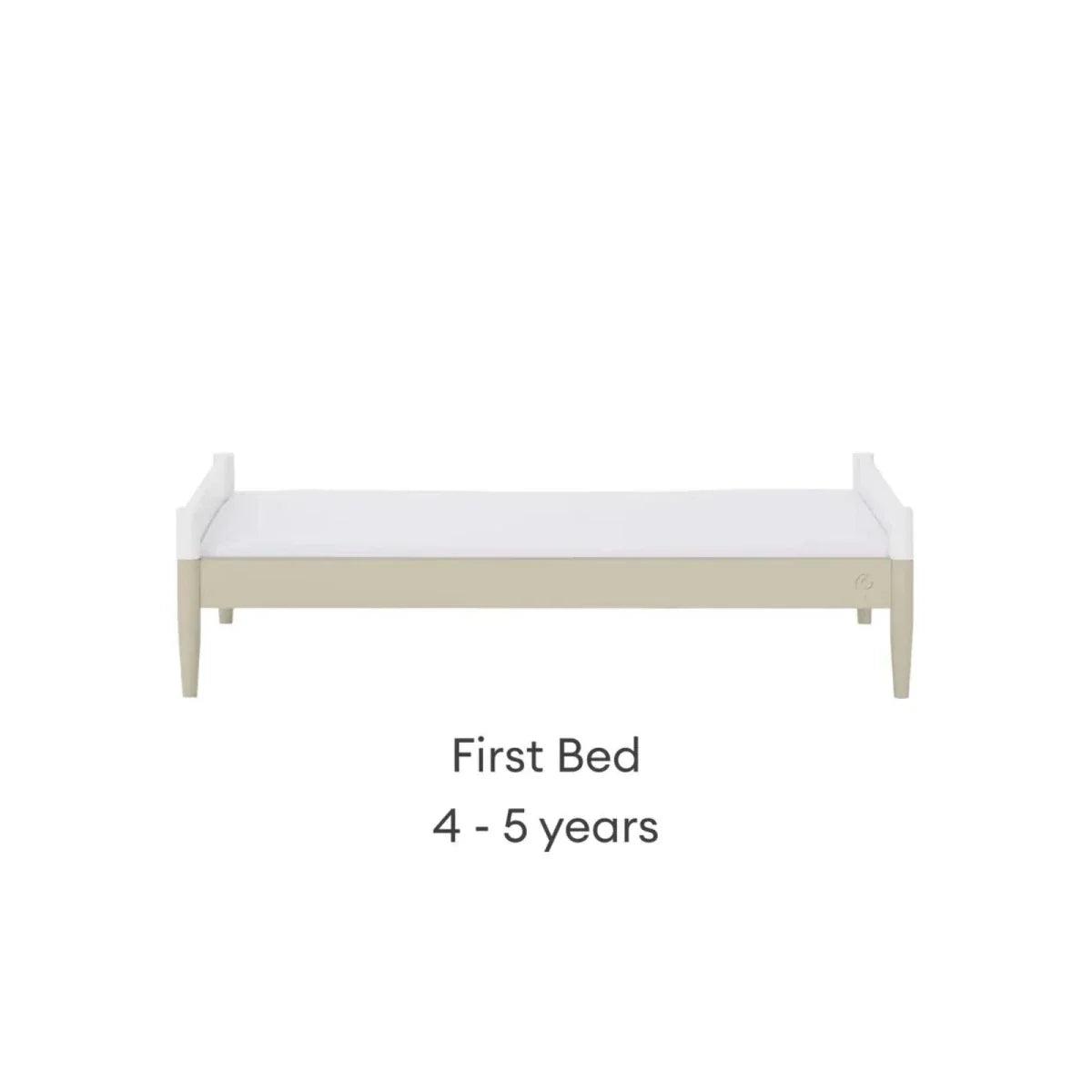 White first bed frame with low rail and light wood legs