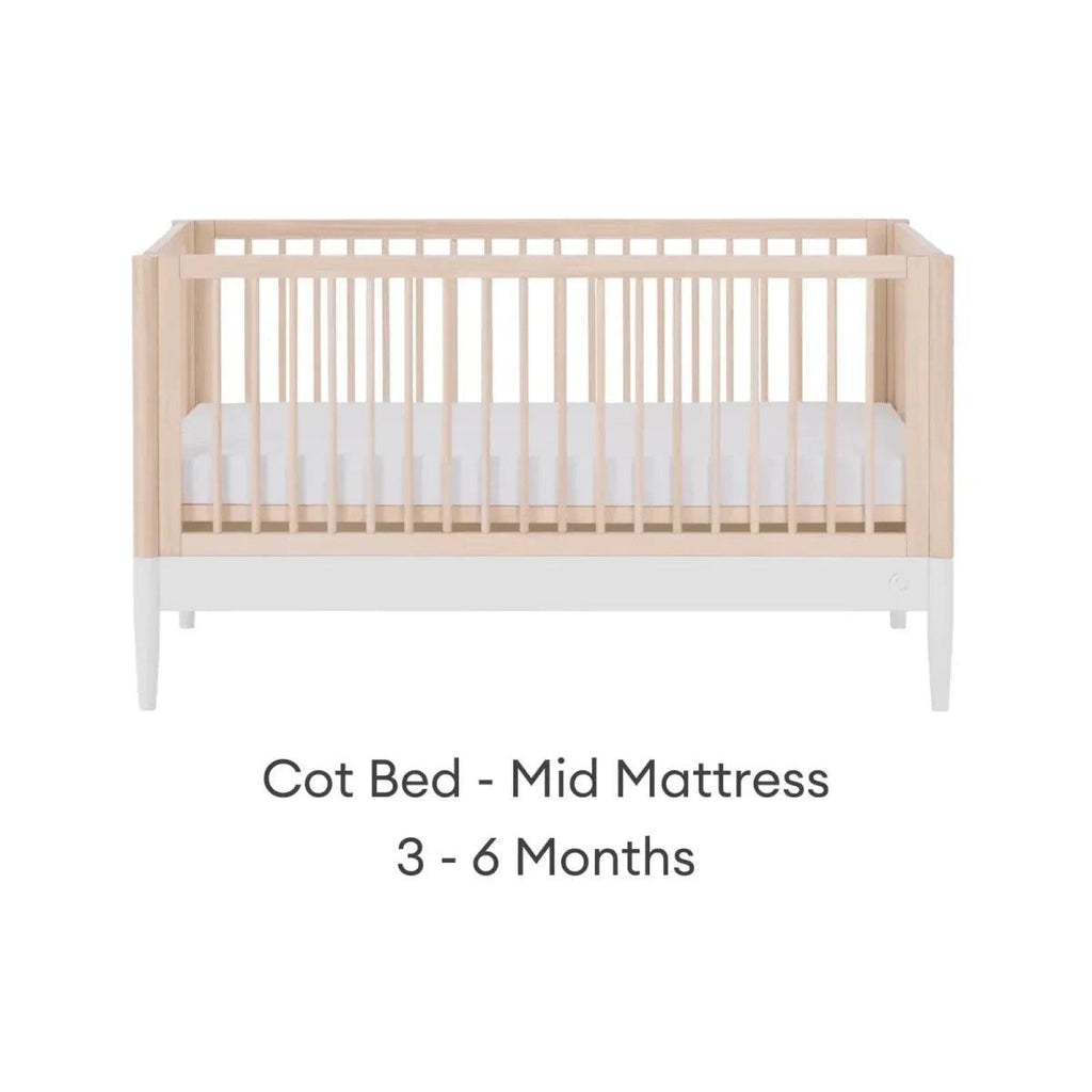 Cot bed with mid mattress position, natural ash frame and white mattress