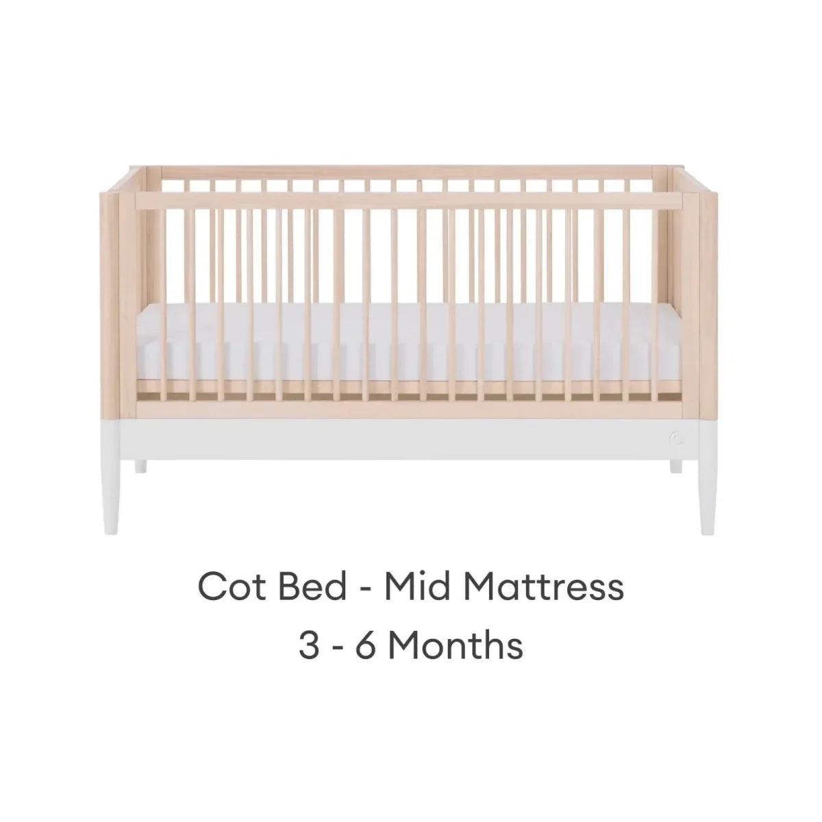 Cot bed with mid mattress position, natural ash frame and white mattress