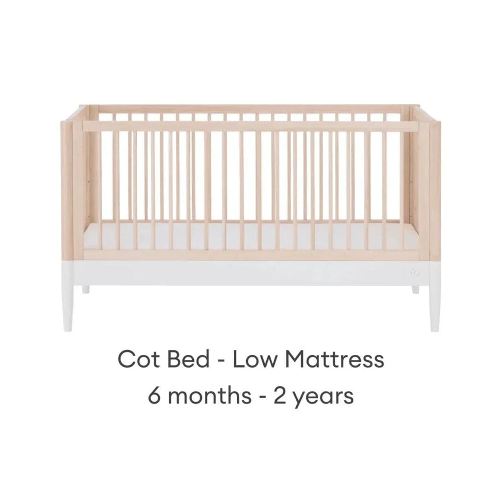 Cot bed with low mattress position, natural ash frame and white mattress