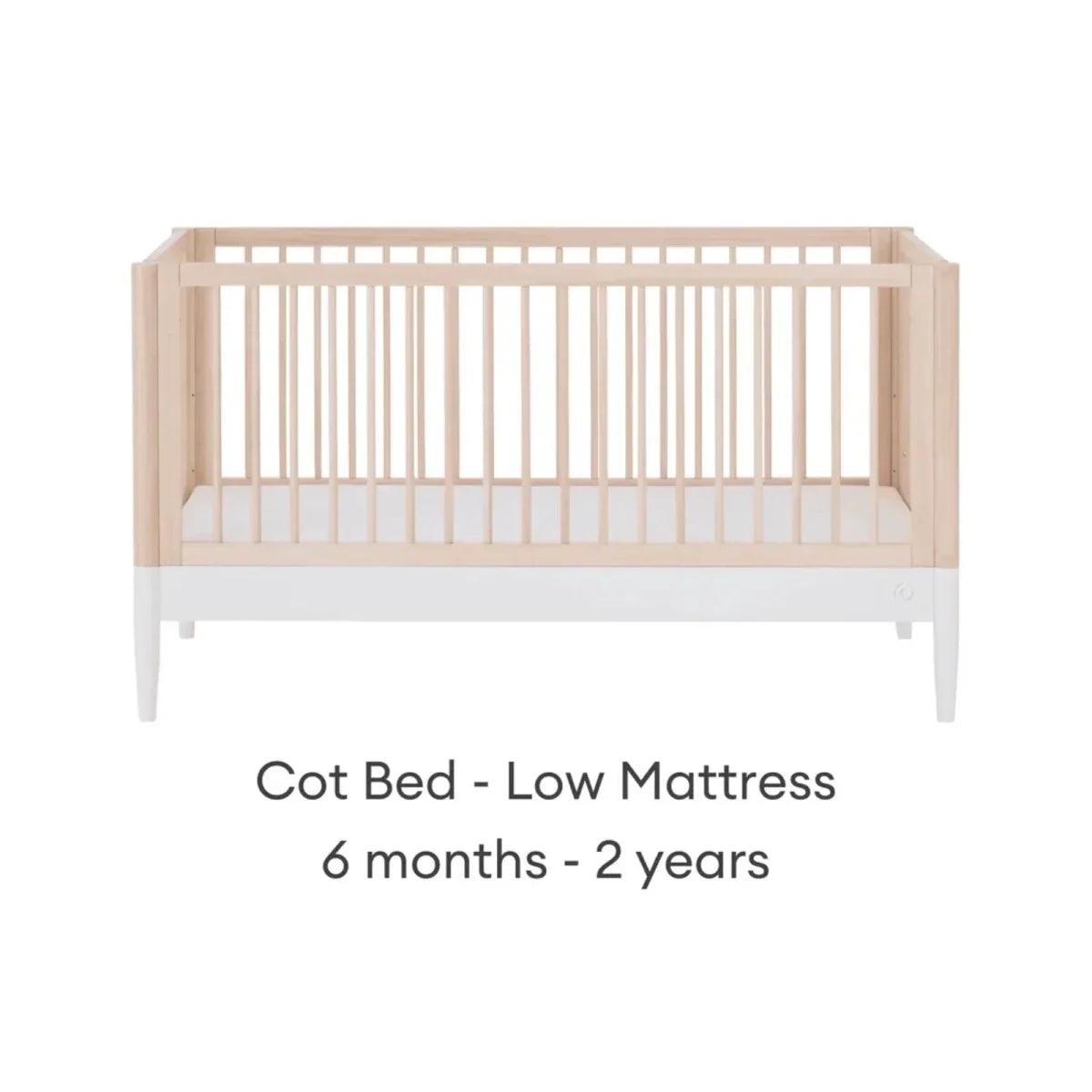 Cot bed with low mattress position, natural ash frame and white mattress
