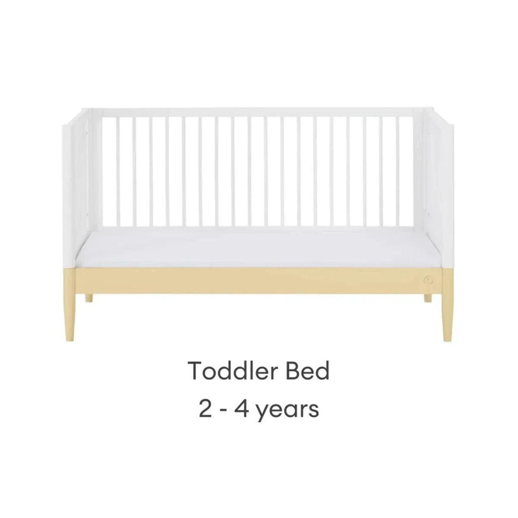 White toddler bed with primrose yellow rail, front view