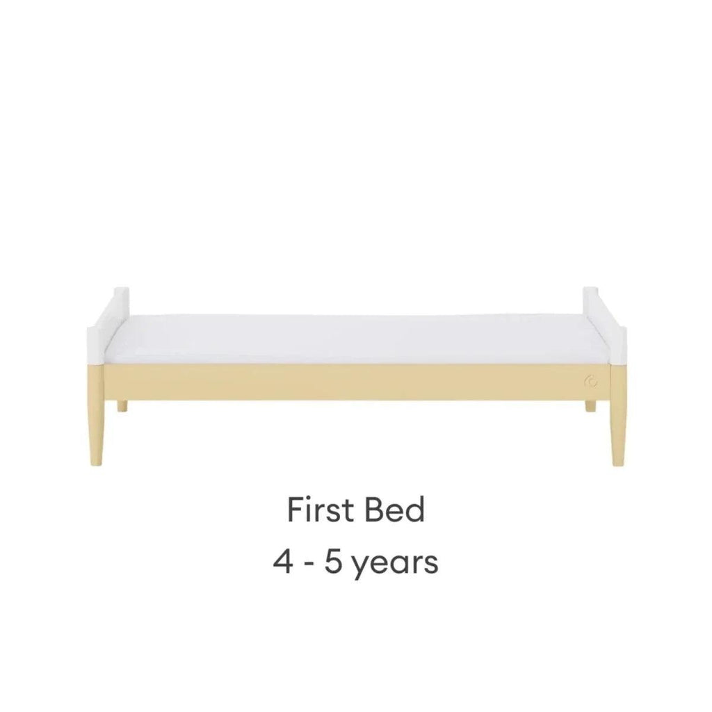 White first bed with primrose yellow rail, front view