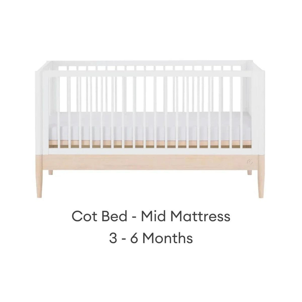 White cot bed with natural rail, mid mattress position for infants