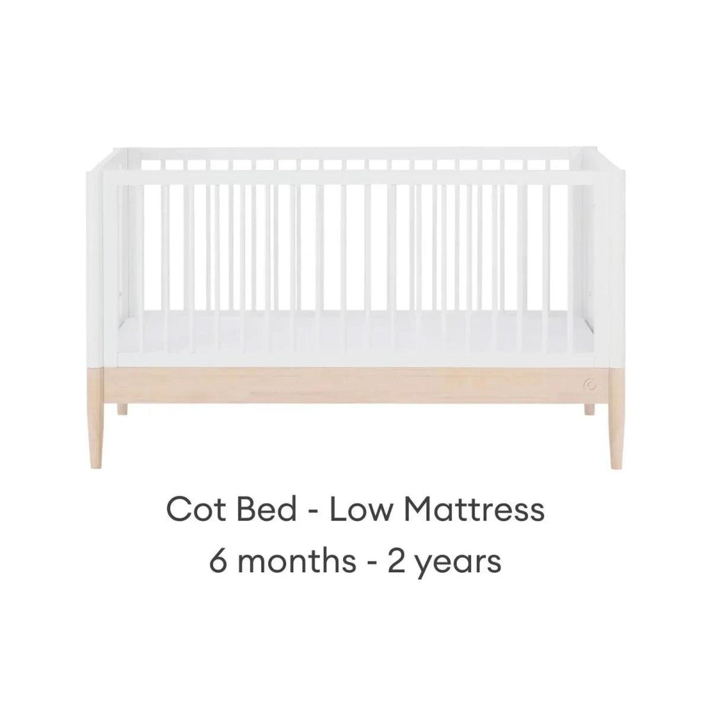 White cot bed with natural rail, low mattress position for toddlers