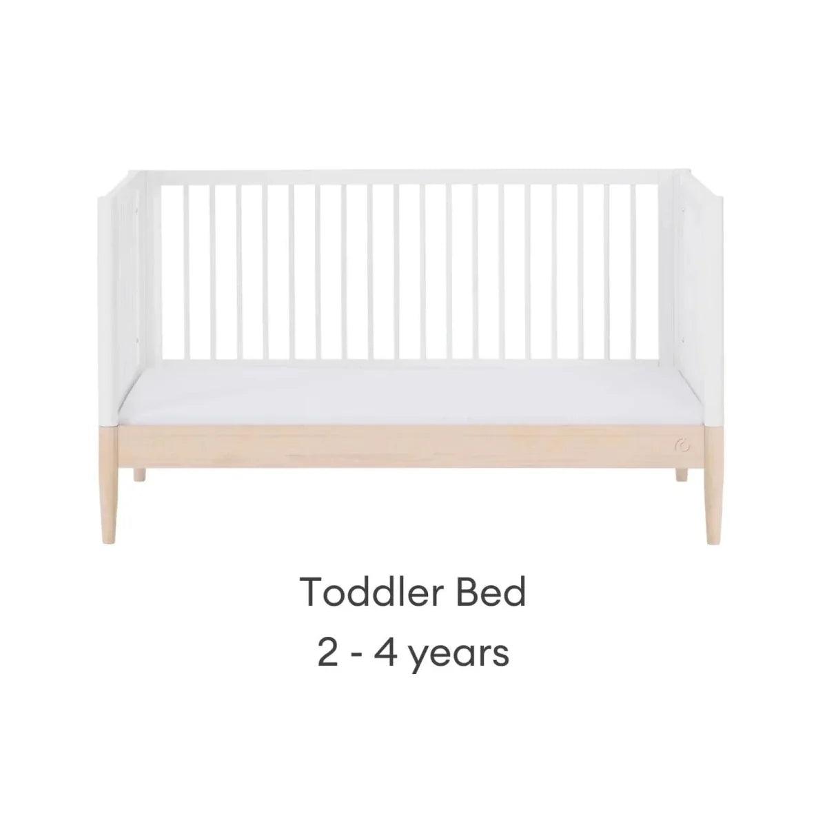 White toddler bed frame with natural base rail and side panels