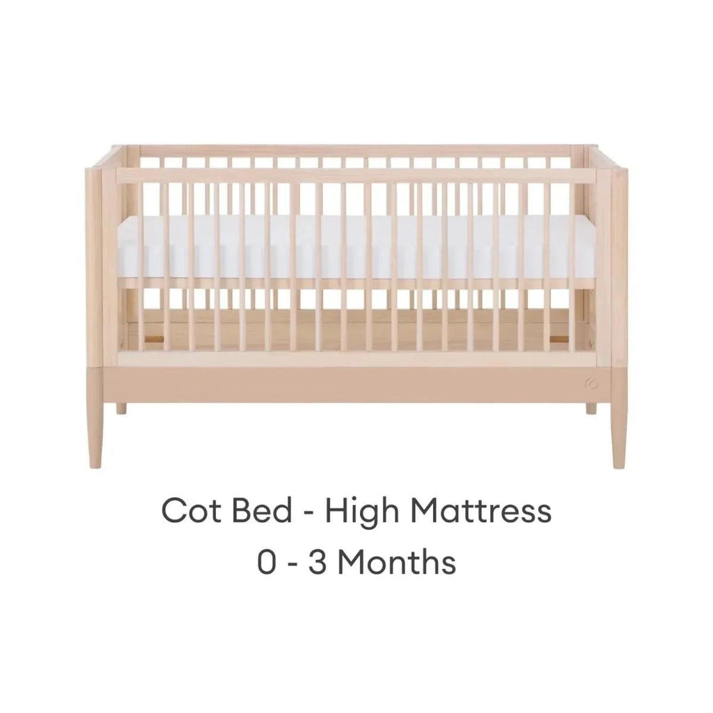 Light wood cot bed with high mattress setting, front view