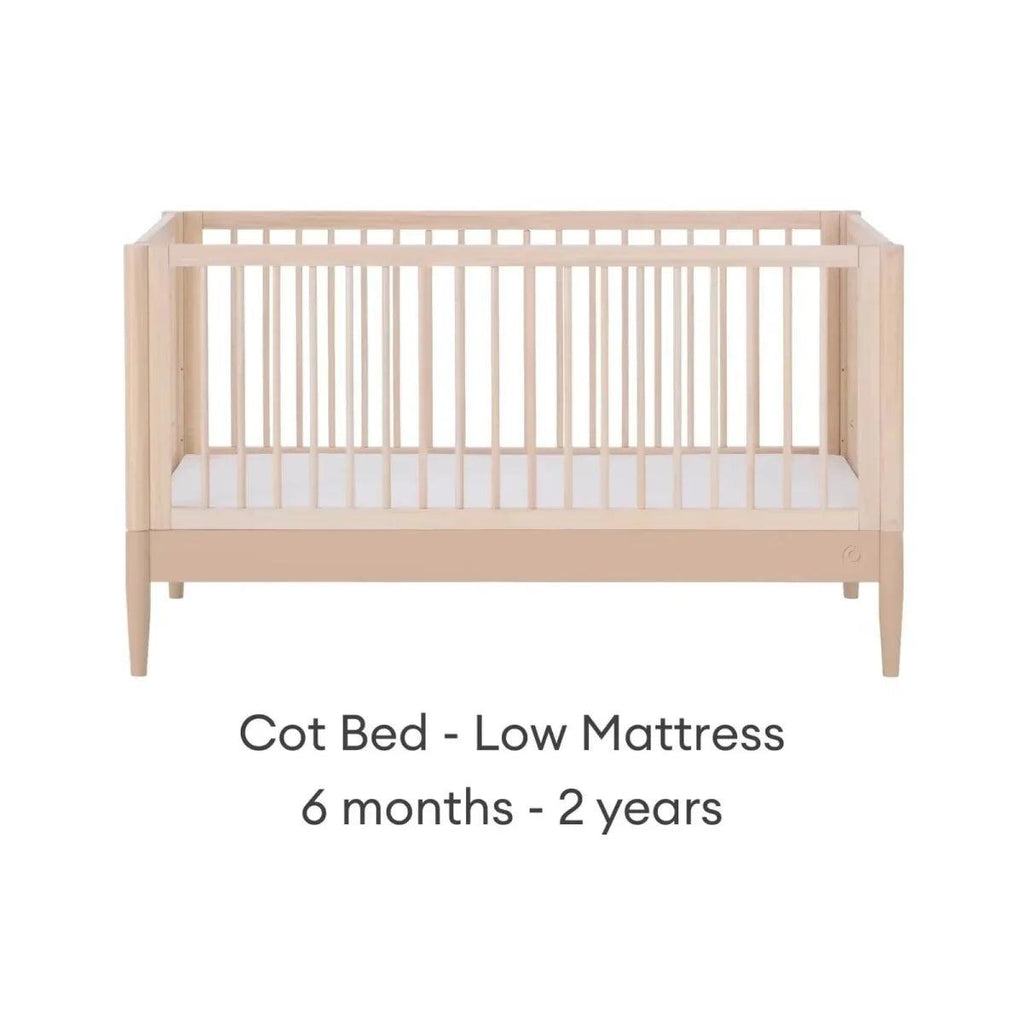 Light wood cot bed with low mattress setting, front view