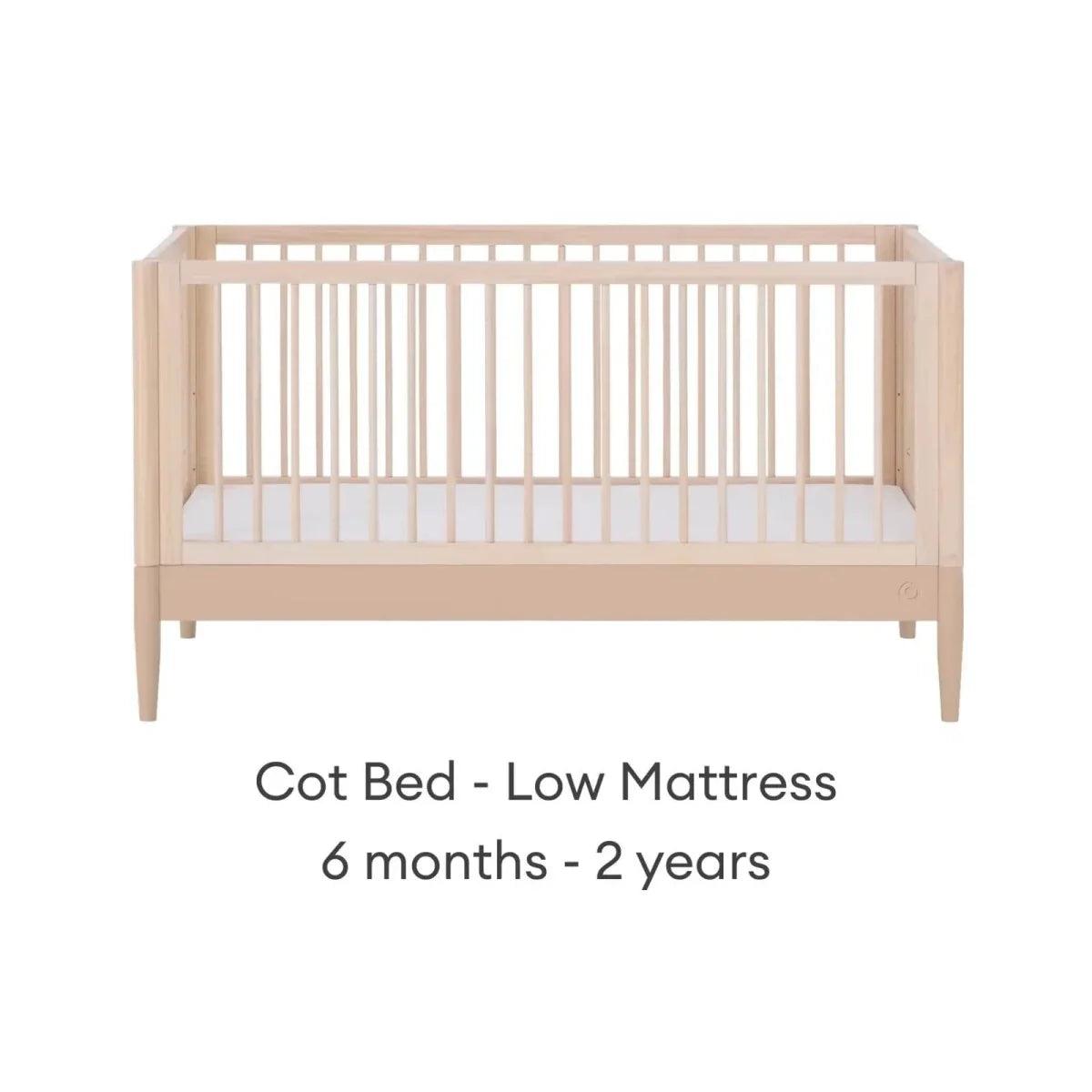 Light wood cot bed with low mattress setting, front view