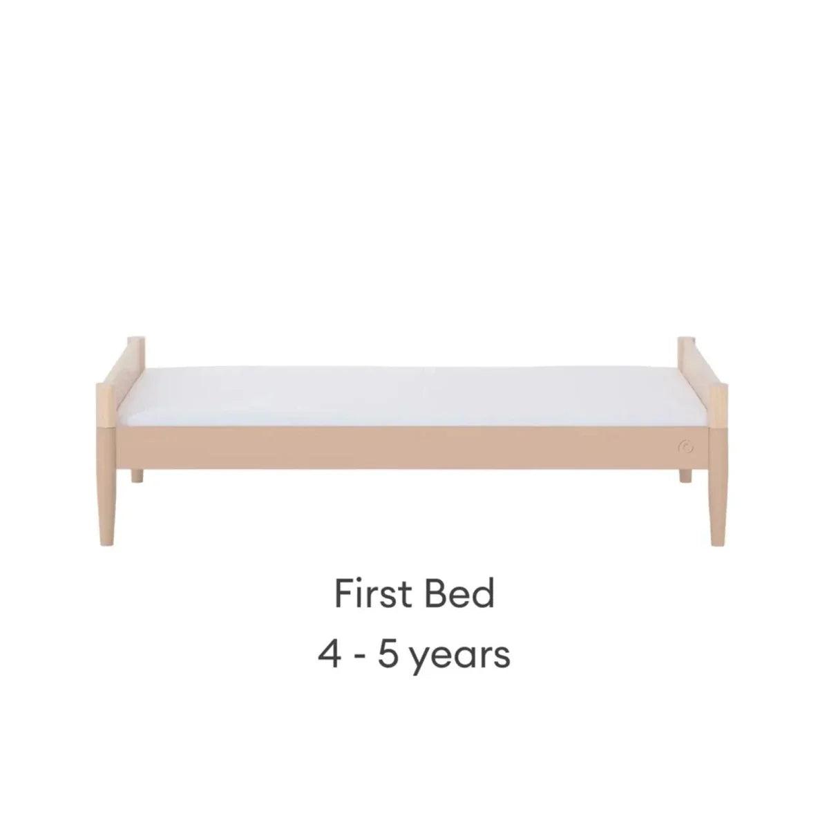 Light wood first bed with mattress platform, front view