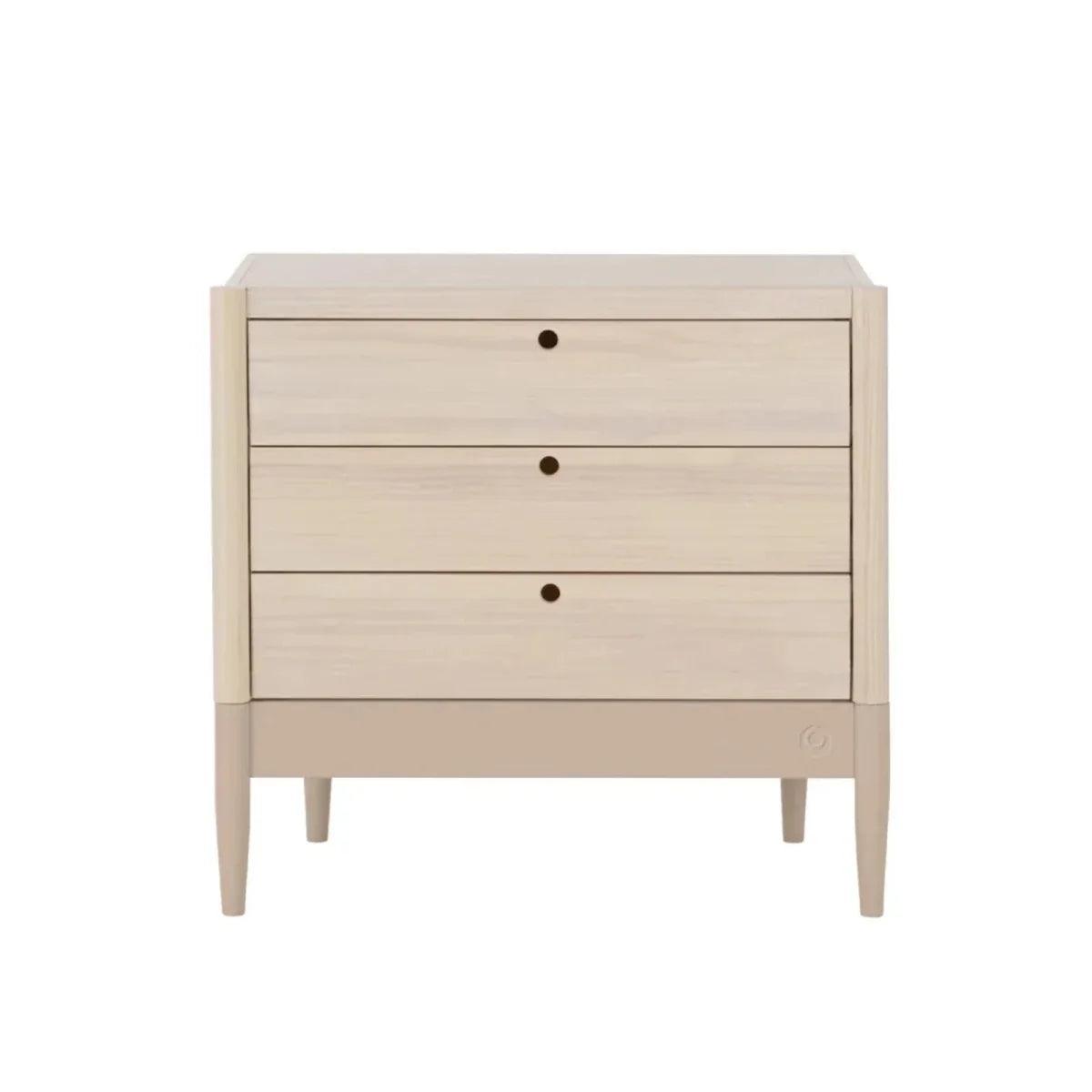 Light wood baby dresser with three drawers and changing top, three round knob pulls