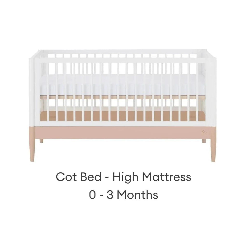 White cot bed with blush mattress band in high position