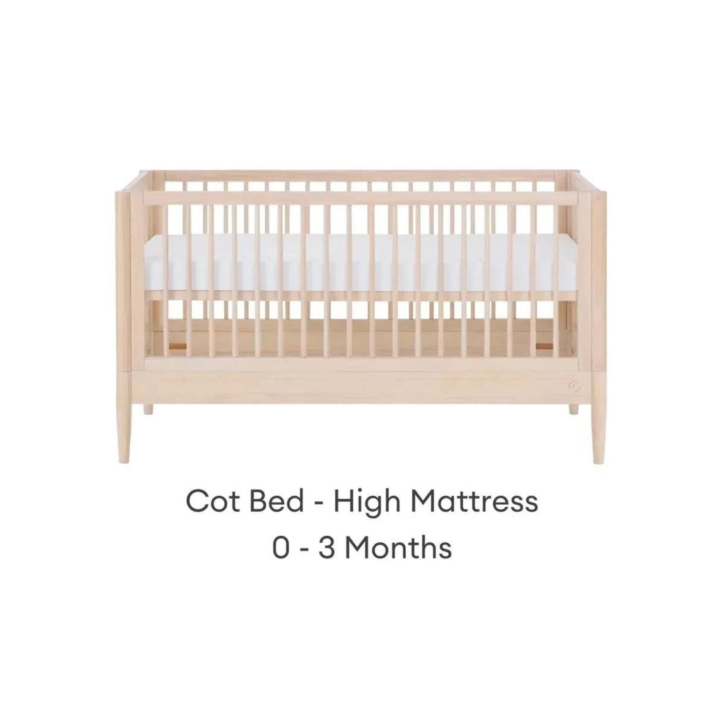 Natural ash cot bed with high mattress position and slatted guard rails