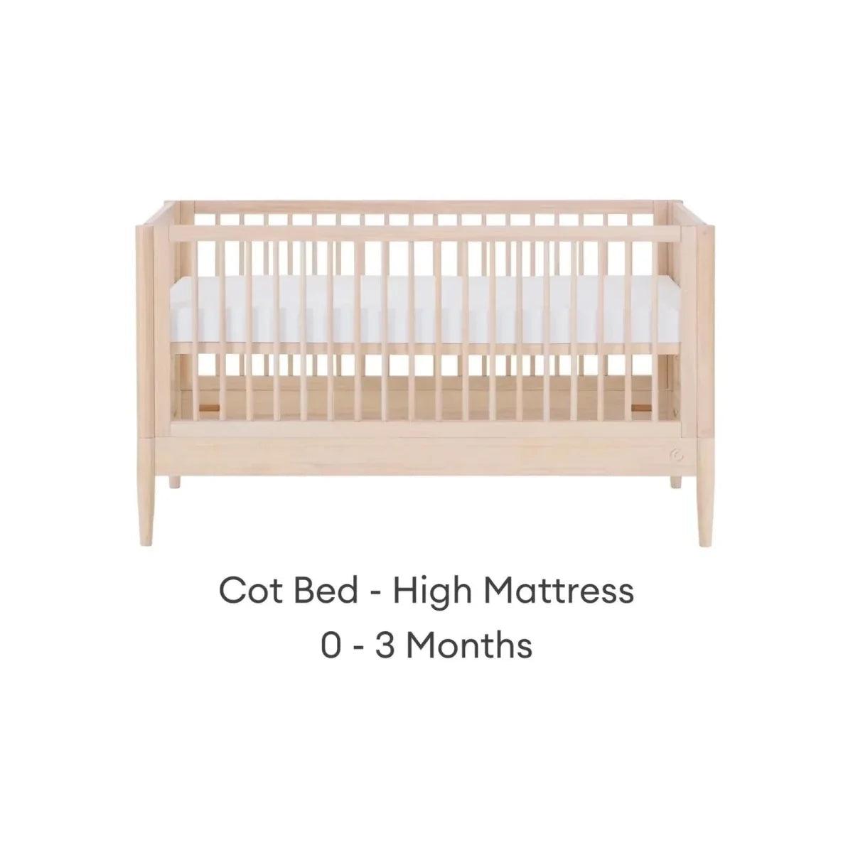 Natural ash cot bed with high mattress position and slatted guard rails