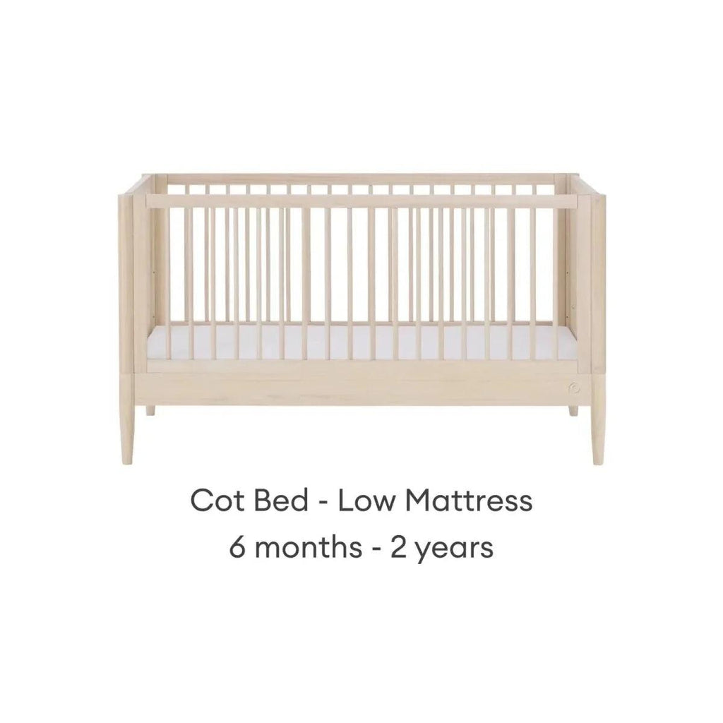 Natural ash cot bed with low mattress position and slatted guard rails