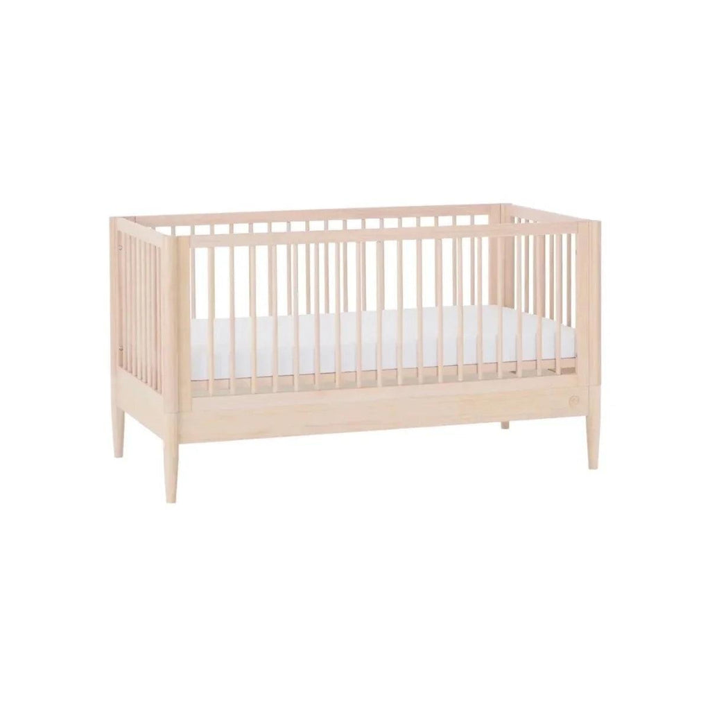 Natural ash cot bed with curved end sections and slatted side rails
