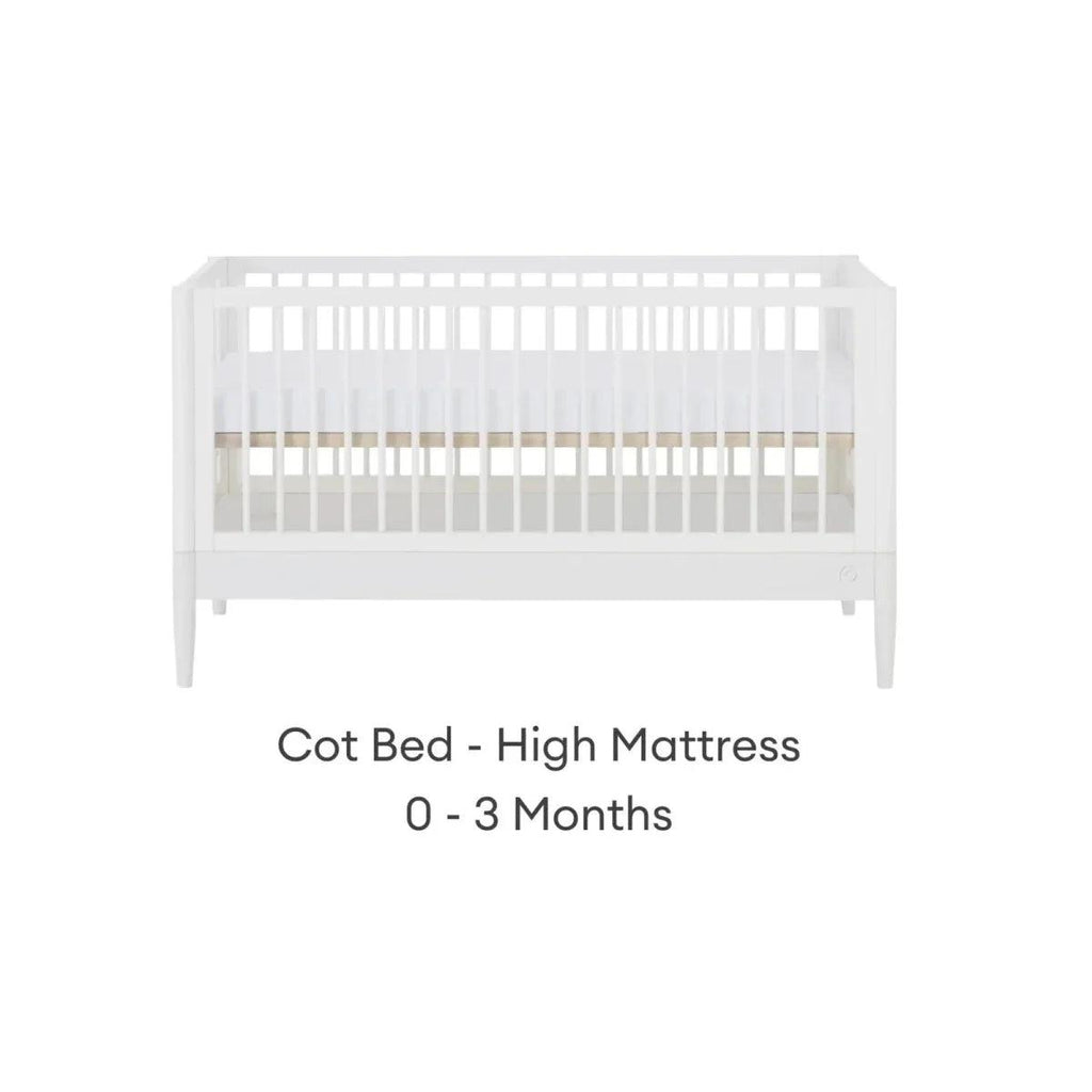 White cot bed with high mattress position and vertical slat guard rails