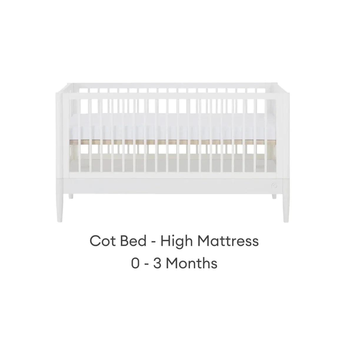 White cot bed with high mattress position and vertical slat guard rails