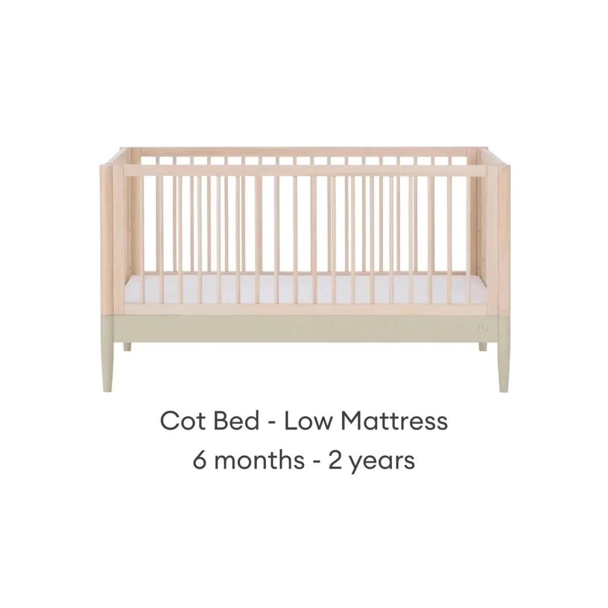 Cot bed in low mattress position, natural wood frame with desert sage lower panel