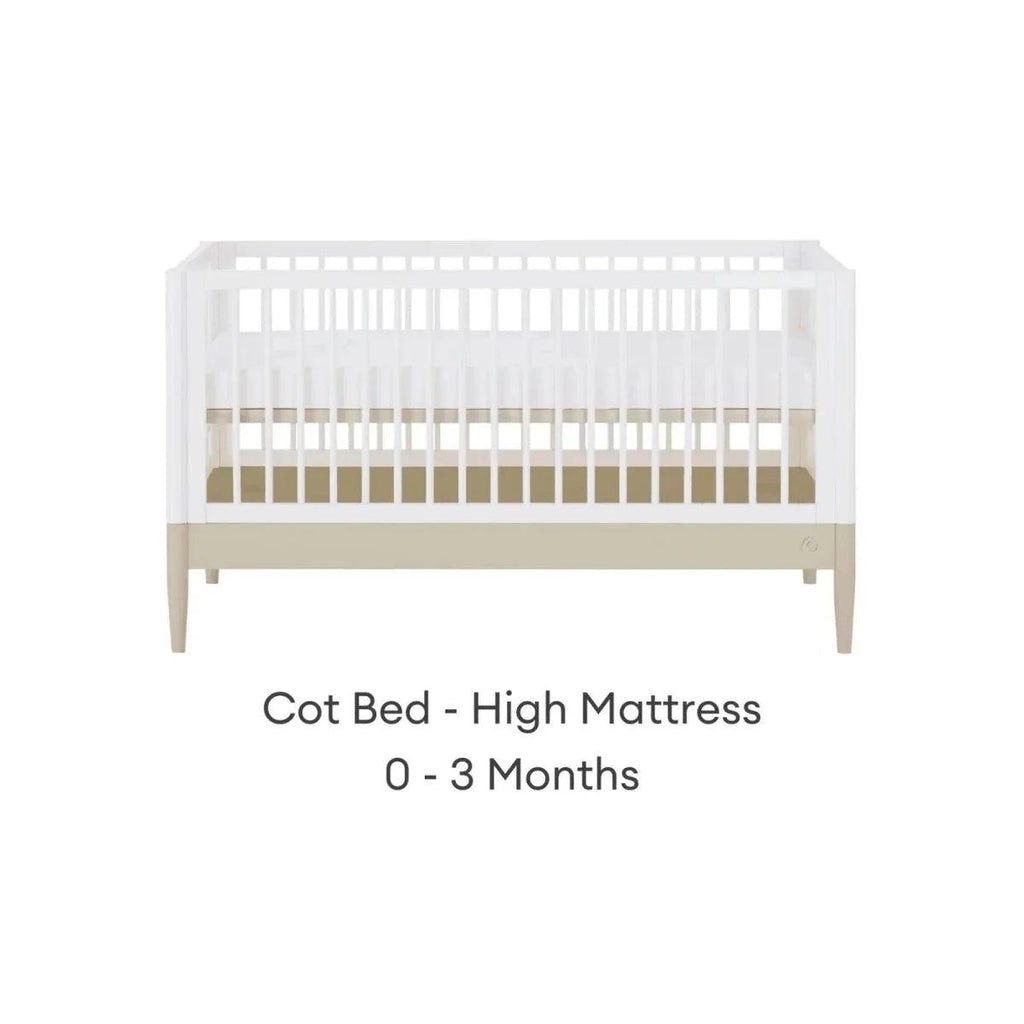 White cot bed with high mattress position and vertical slat rail