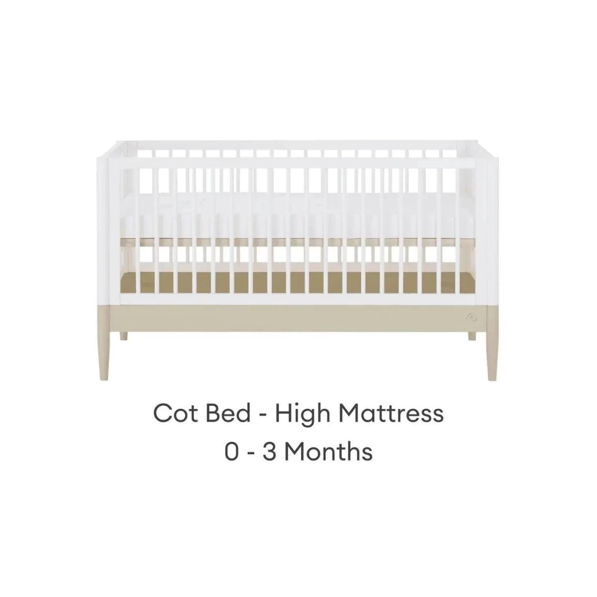 White cot bed with high mattress position and vertical slat rail