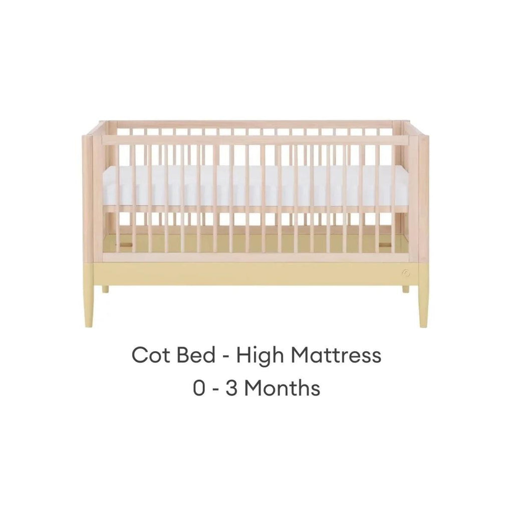 Cot bed frame in natural wood with primrose yellow panel and high mattress position