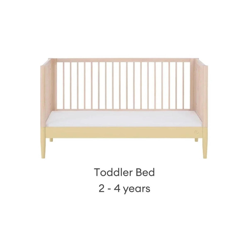 Toddler bed frame in natural wood with primrose yellow base rail and side legs