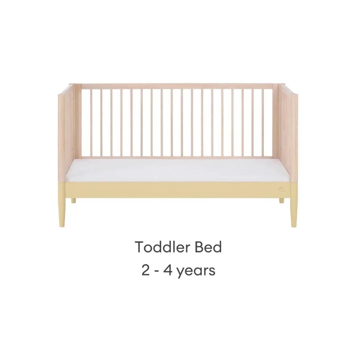Toddler bed frame in natural wood with primrose yellow base rail and side legs