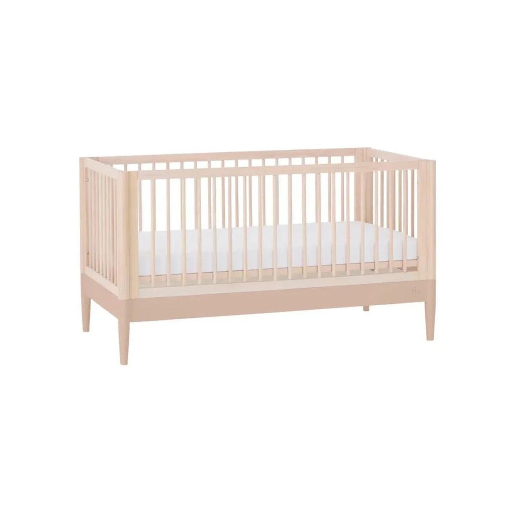 Gaia Baby Eos nursery cot bed in natural ash with powder blush lower panel, side view