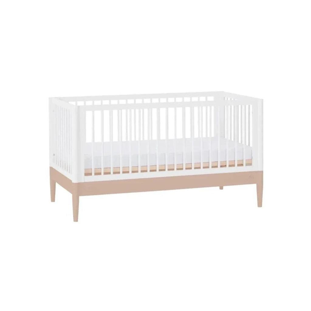 White bed frame with powder blush rail and vertical slat sides