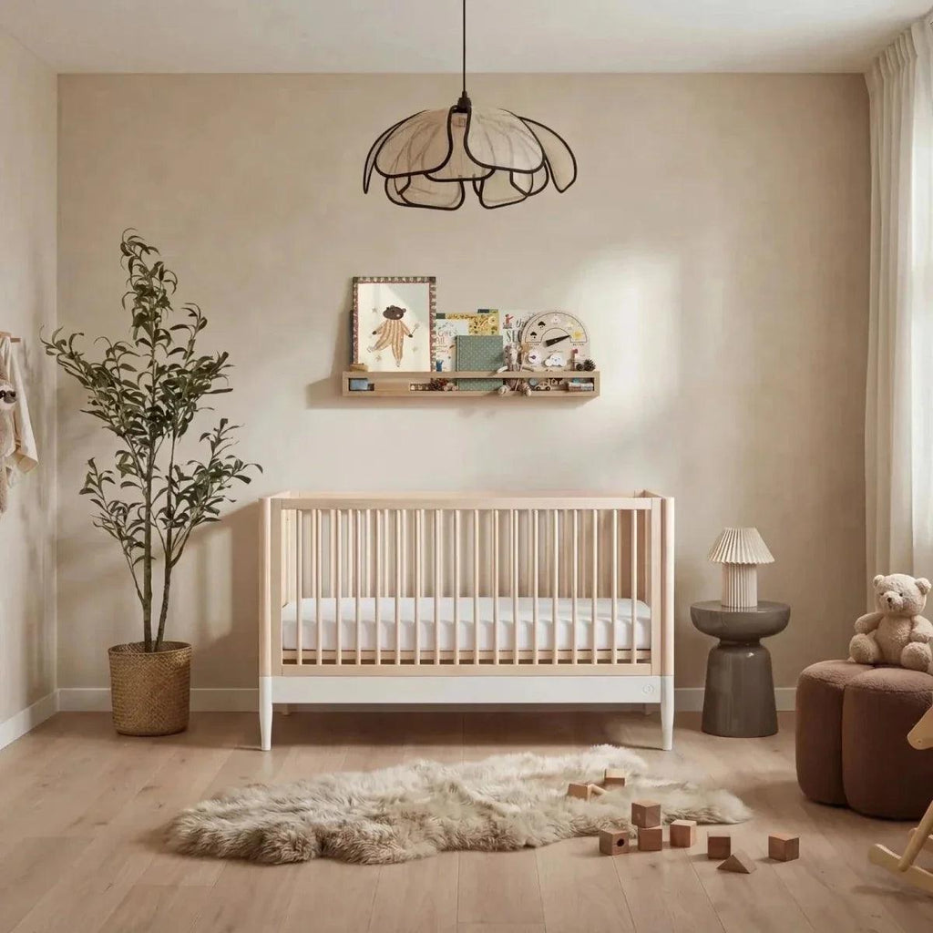 White and natural ash nursery cot bed with vertical slat sides and open headboard