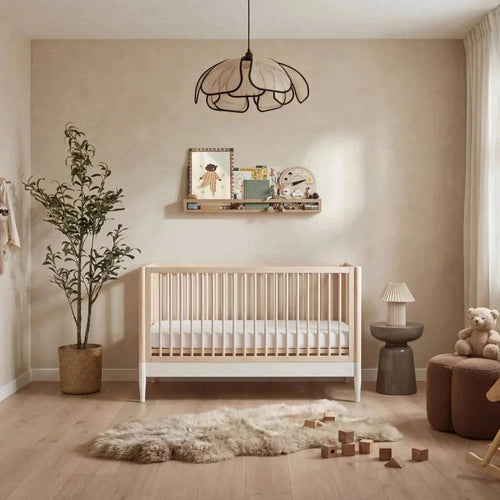 White and natural ash nursery cot bed with vertical slat sides and open headboard