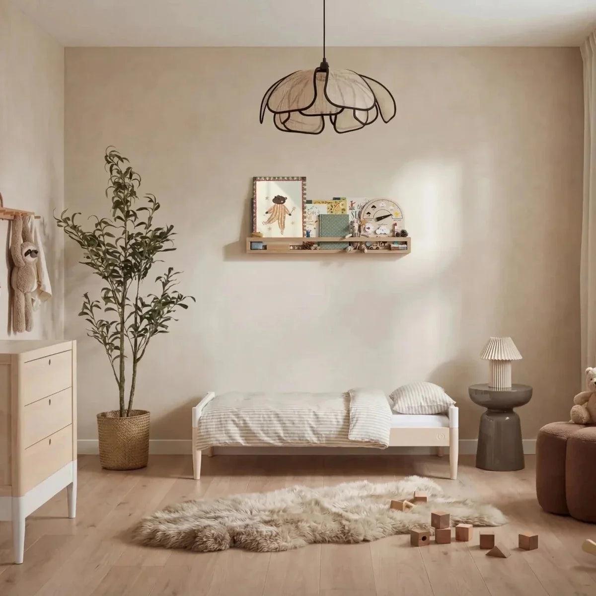 White and natural ash nursery cot bed with slatted rails and short mattress base