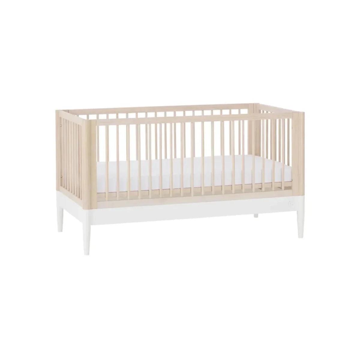White and natural ash nursery cot bed with corner posts and vertical slat sides