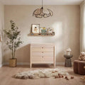 Baby dresser in light ash wood with three drawers and round knobs