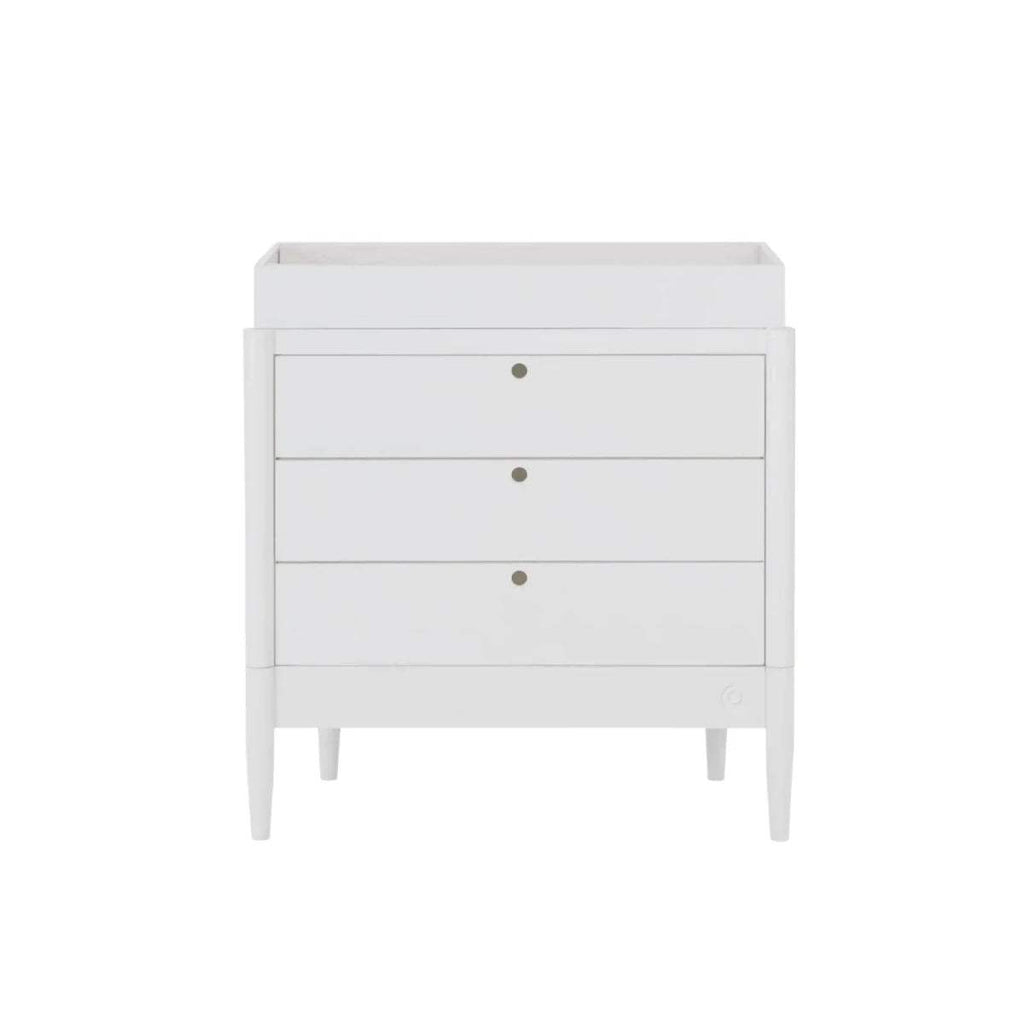 White baby dresser front view, three drawers with gold knobs and tapered legs