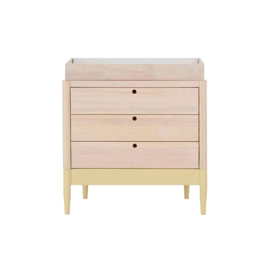 Baby dresser front view with three drawers, pale wood top, primrose yellow base.
