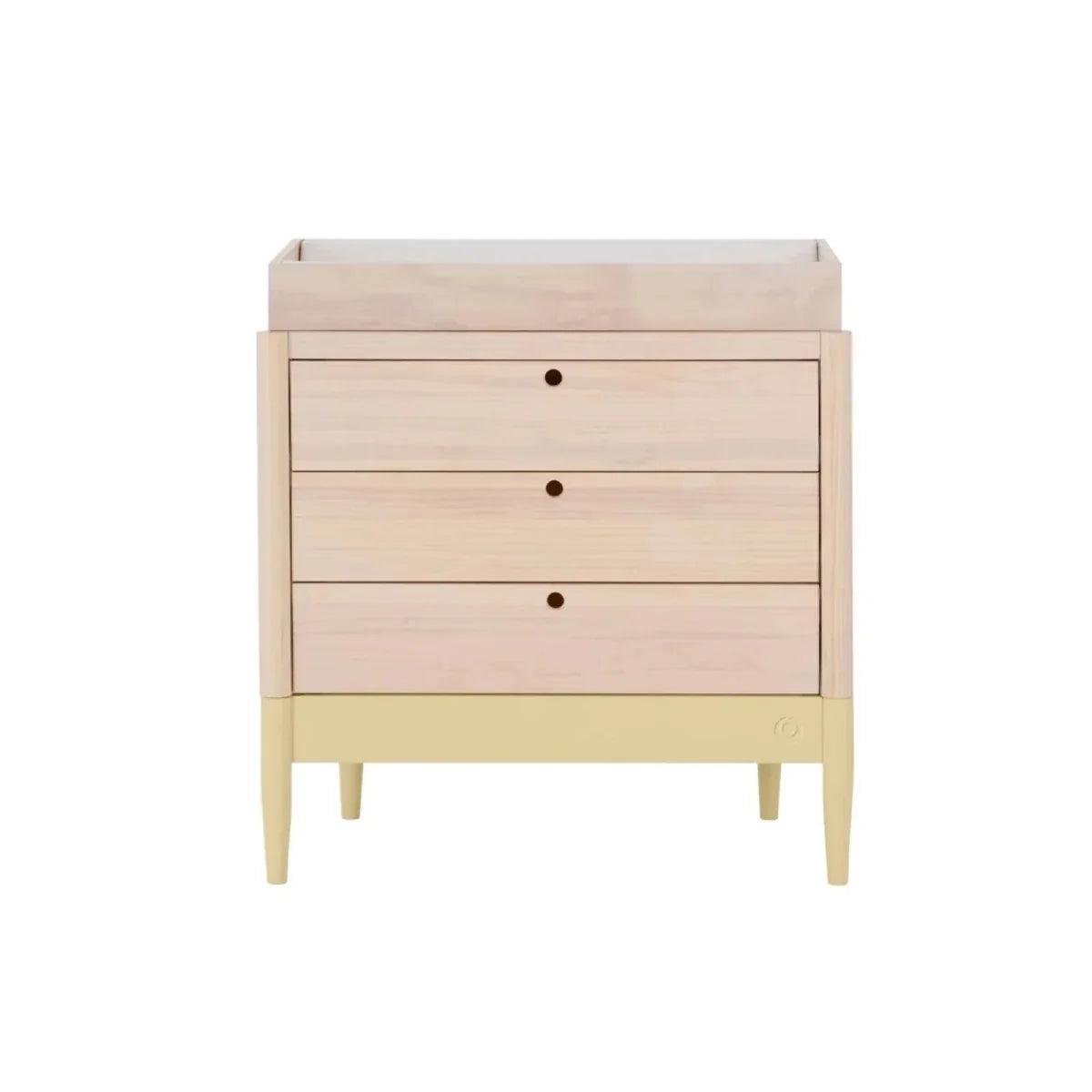 Baby dresser front view with three drawers, pale wood top, primrose yellow base.