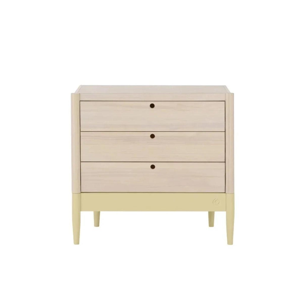 Baby dresser front with three drawer rows, pale wood panels and primrose yellow legs.