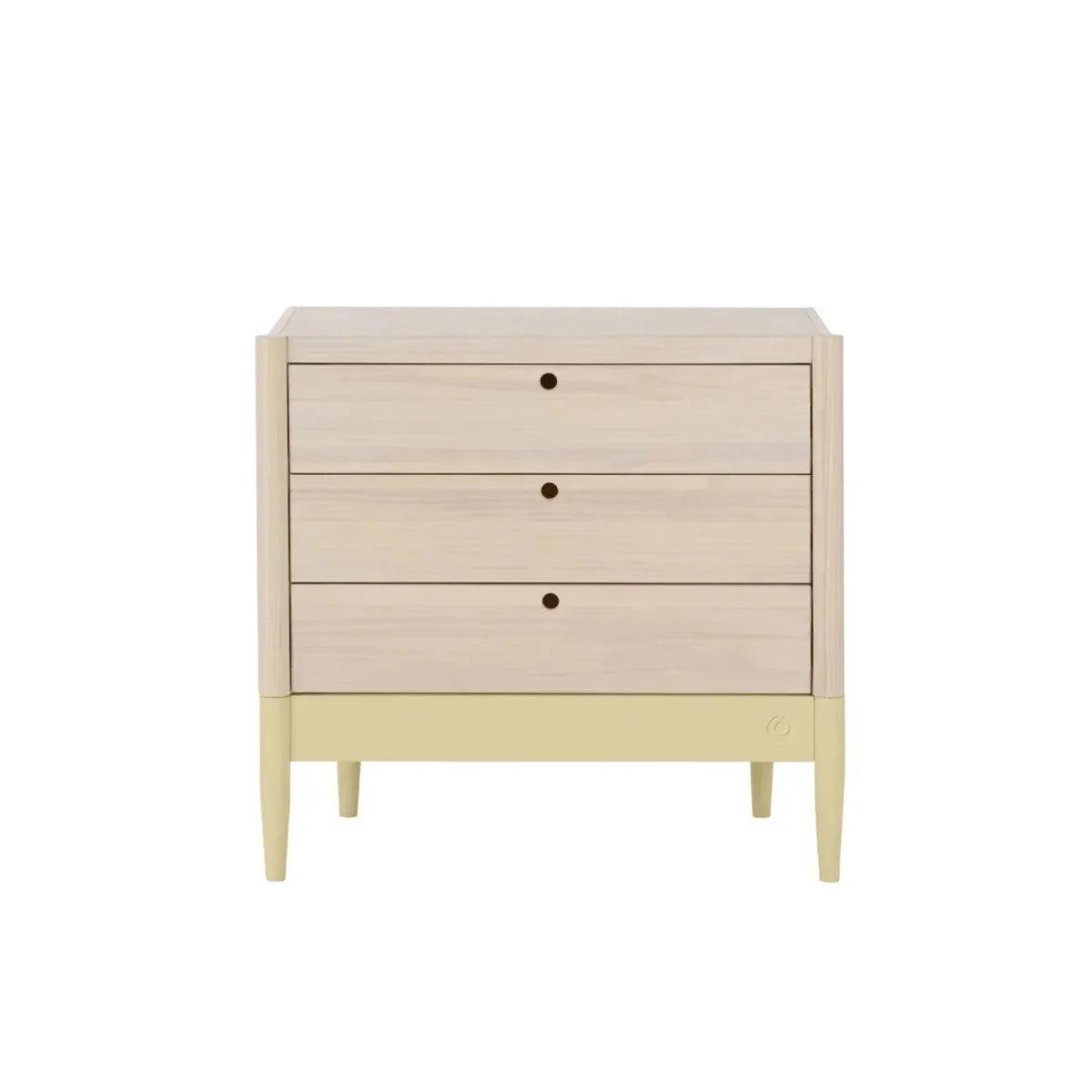 Baby dresser front with three drawer rows, pale wood panels and primrose yellow legs.