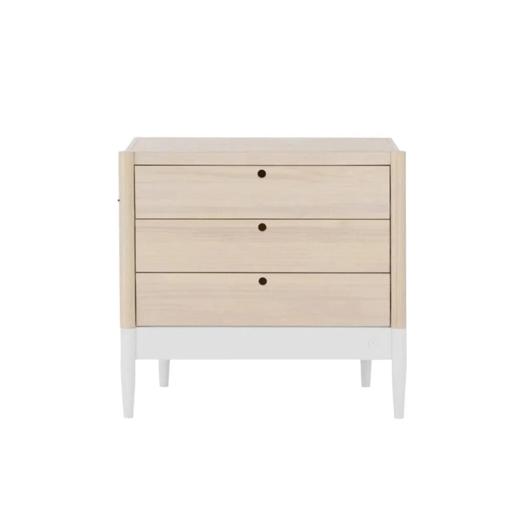 White and natural baby dresser, angled front view, three drawers and round knobs