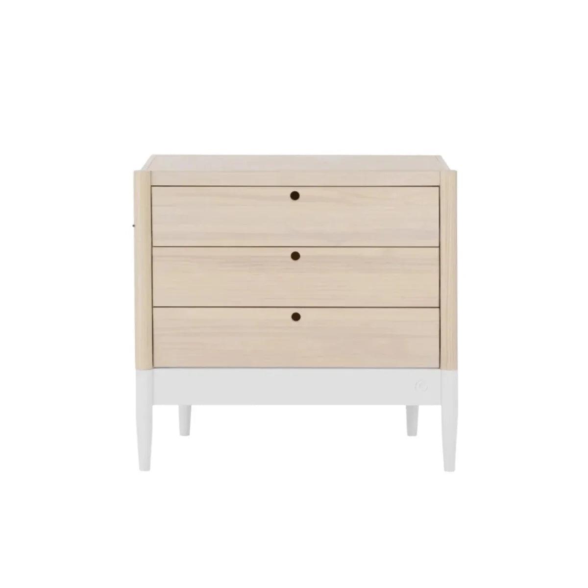 White and natural baby dresser, angled front view, three drawers and round knobs