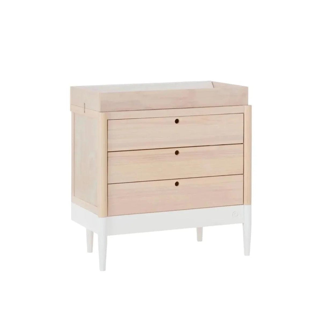 White and natural baby dresser with three drawers, open top ledge, round knobs