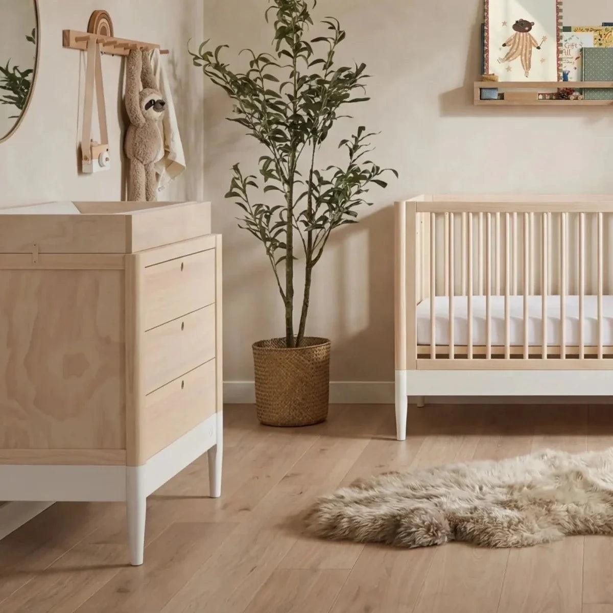 White and natural baby dresser cabinet with three drawers and round knobs