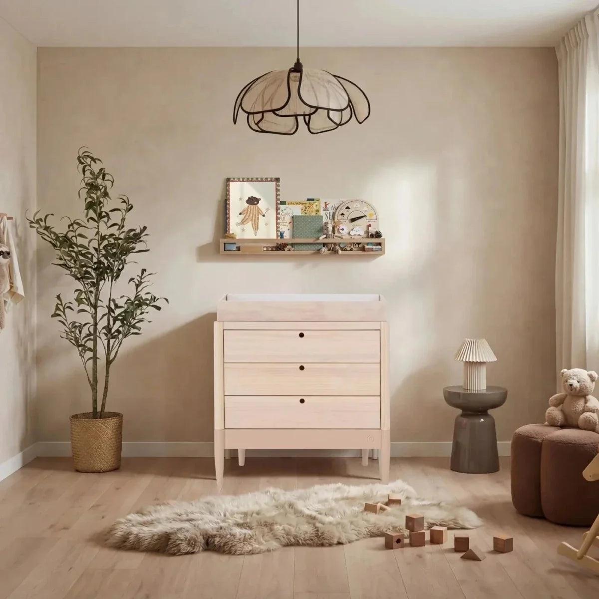 Baby dresser with three drawers and open changing top in powder blush and natural ash