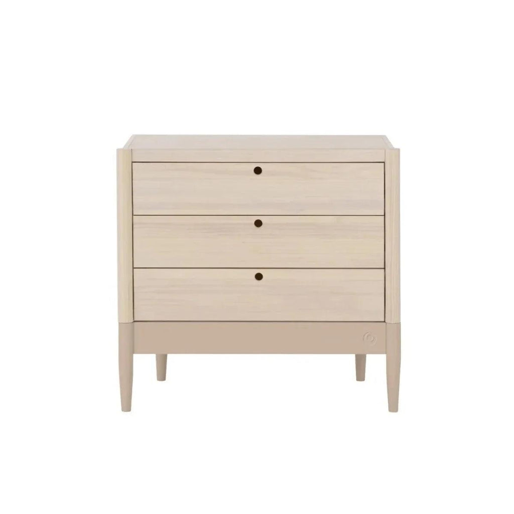 Baby dresser with four drawers in natural ash and powder blush trim, front view